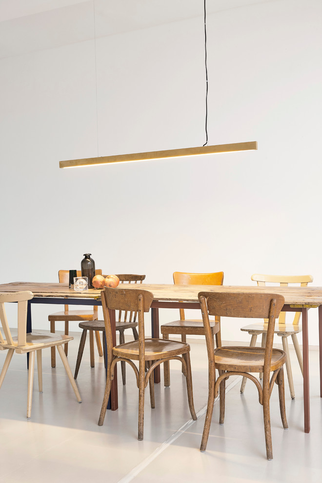 Inspiration for an expansive scandinavian dining room in Berlin with white walls and white floor.