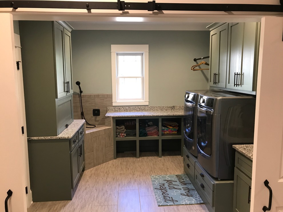 Mid-sized transitional u-shaped dedicated laundry room in Raleigh with shaker cabinets, grey cabinets, granite benchtops, grey walls, vinyl floors, a side-by-side washer and dryer and beige floor.