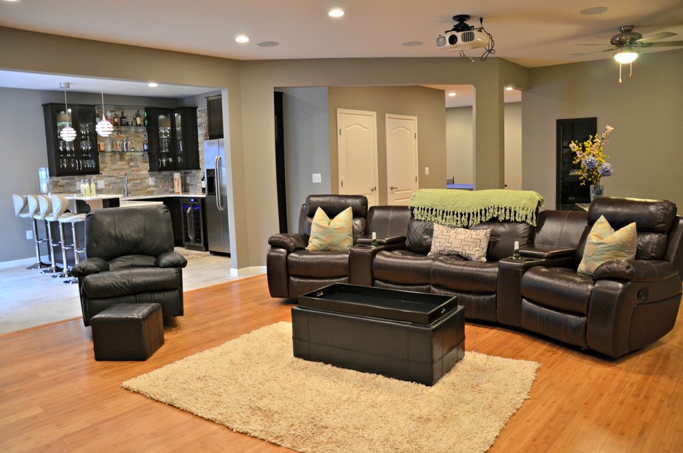 Photo of an expansive transitional look-out basement in DC Metro with grey walls and medium hardwood floors.