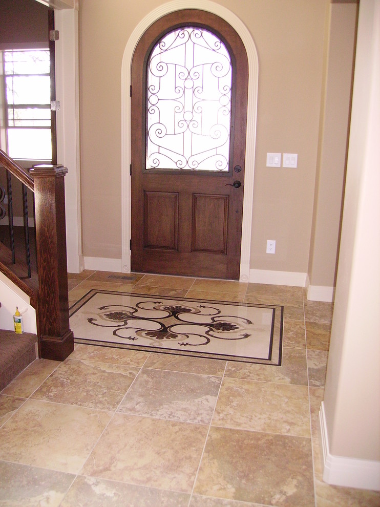 Front door - ceramic tile front door idea in Denver with beige walls and a medium wood front door