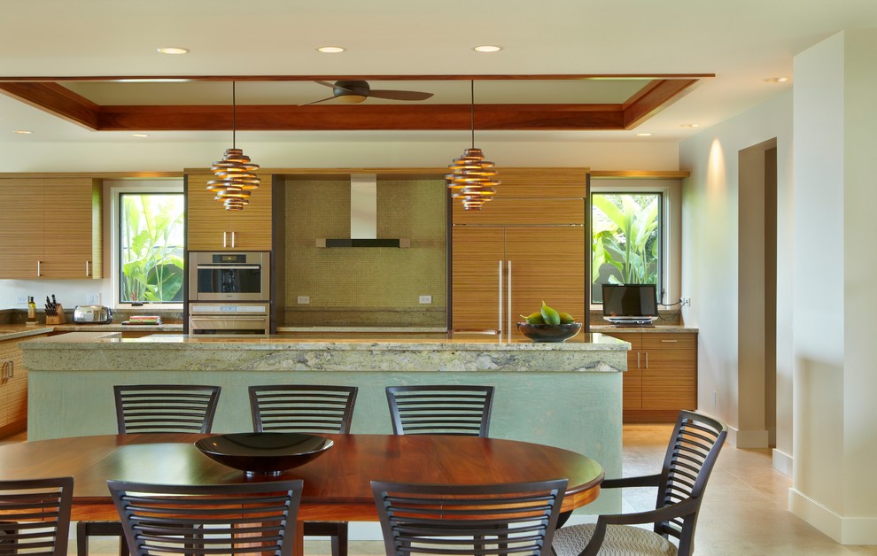 Inspiration for a contemporary l-shaped eat-in kitchen in Hawaii with flat-panel cabinets and panelled appliances.