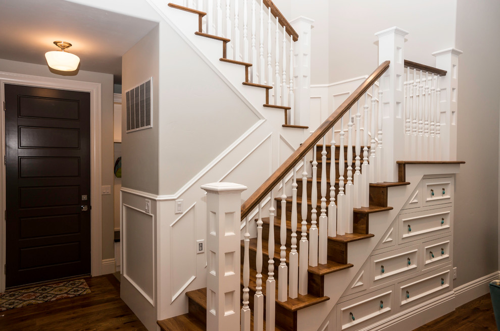 Mid-sized arts and crafts wood l-shaped staircase in Other with wood risers and wood railing.