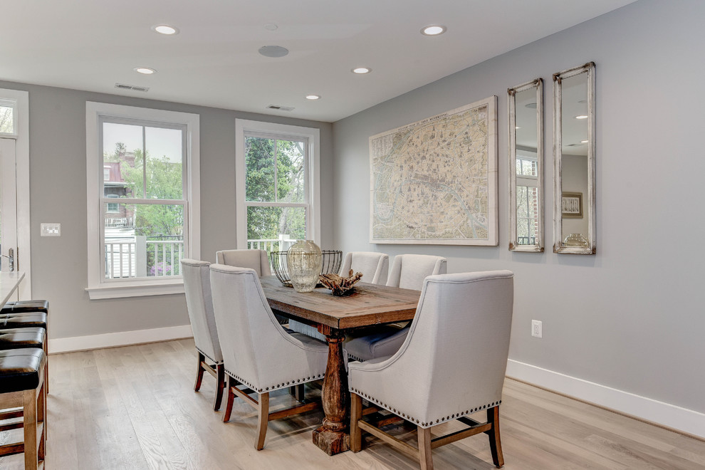Design ideas for a large transitional open plan dining in DC Metro with grey walls, light hardwood floors and no fireplace.