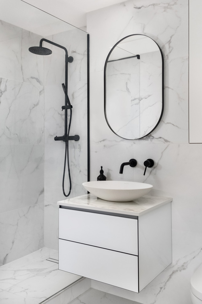 Design ideas for a mid-sized contemporary master wet room bathroom in Other with white cabinets, a wall-mount toilet, white tile, ceramic tile, ceramic floors, a console sink, engineered quartz benchtops, white floor, an open shower, white benchtops, a niche, a single vanity and a floating vanity.