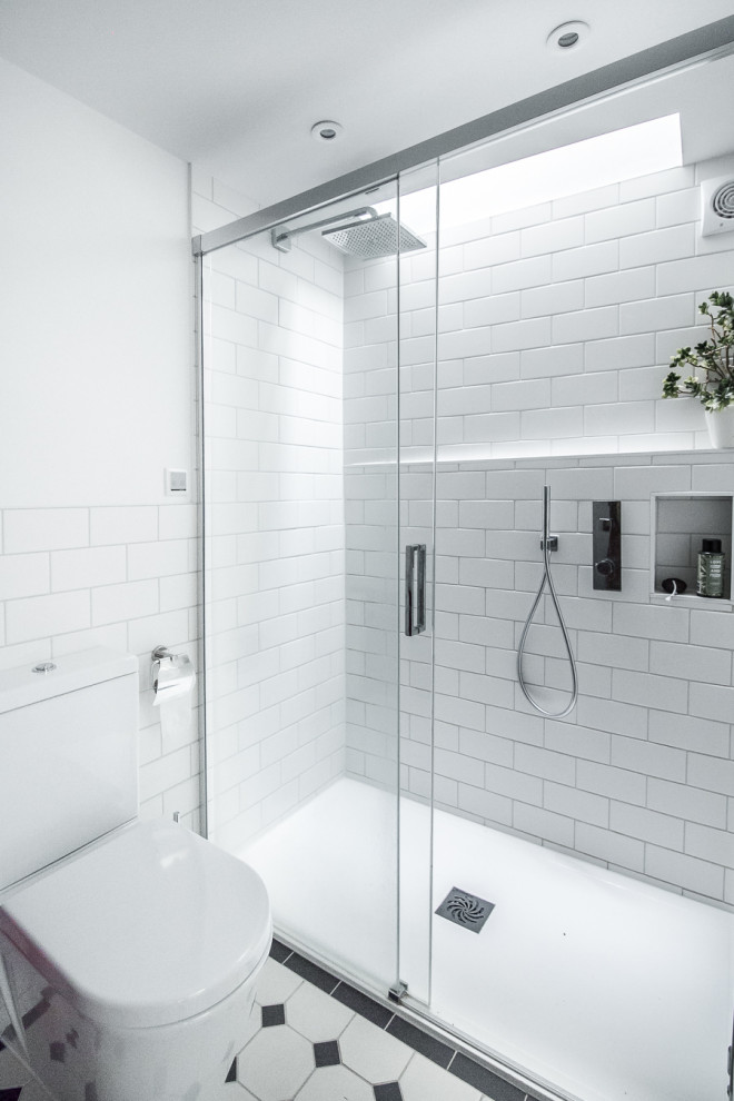 Inspiration for a small transitional 3/4 bathroom in Surrey with shaker cabinets, red cabinets, an open shower, a one-piece toilet, white tile, subway tile, white walls, ceramic floors, a console sink, multi-coloured floor, a sliding shower screen, a single vanity and a freestanding vanity.
