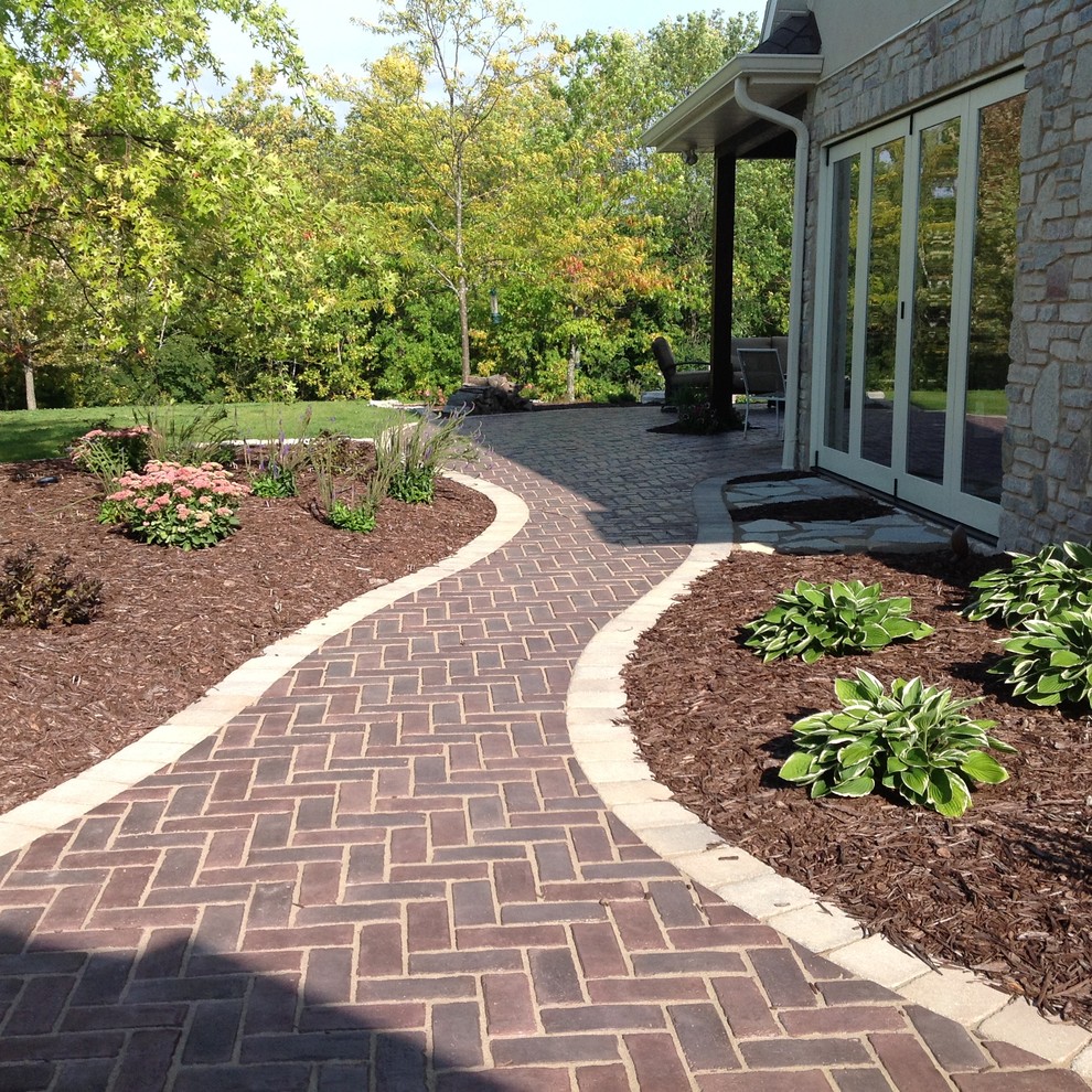 Patio - large rustic side yard patio idea with no cover