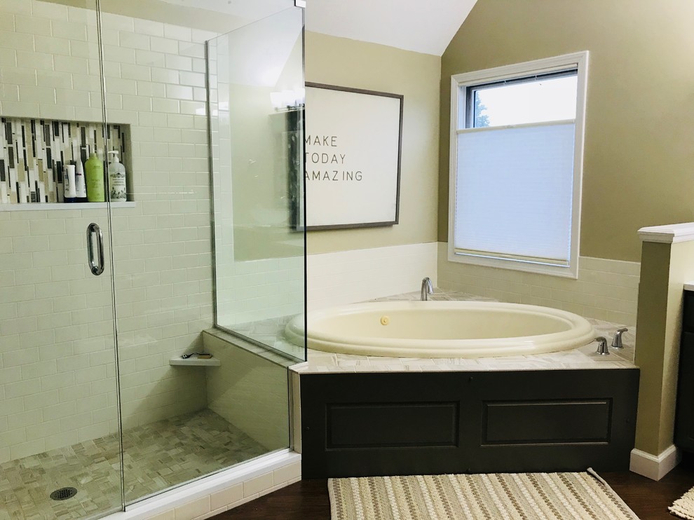 Mid-sized transitional master white tile vinyl floor drop-in bathtub photo with quartz countertops and a hinged shower door