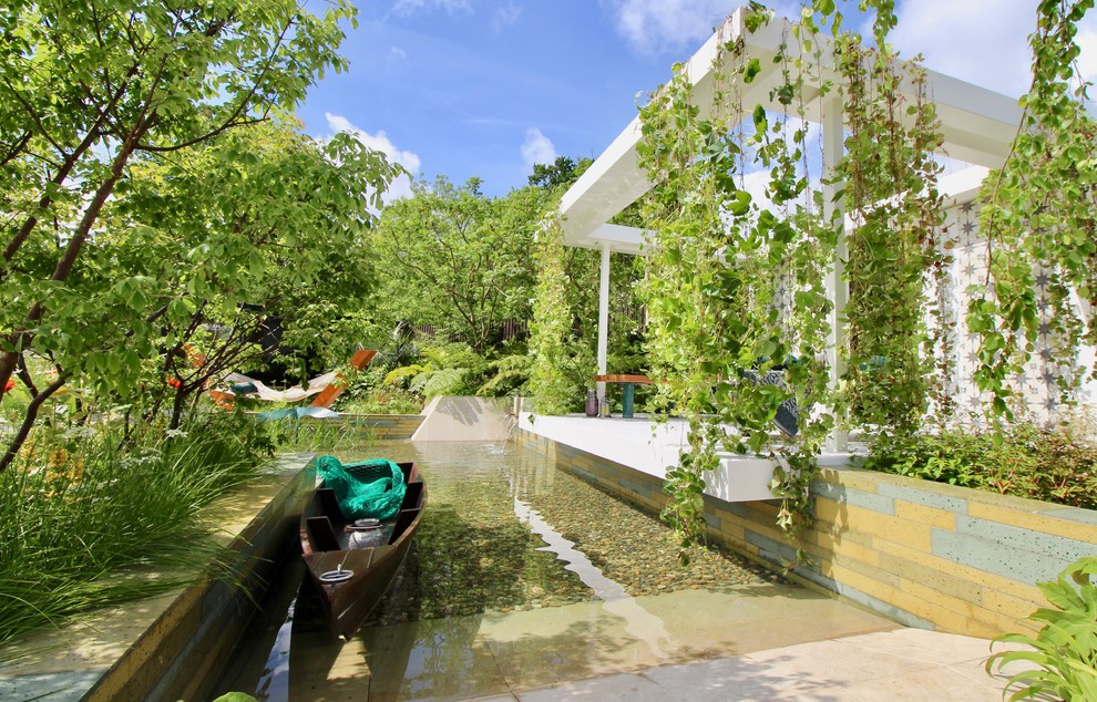 Photo of a large tropical backyard partial sun garden for summer in Dublin.