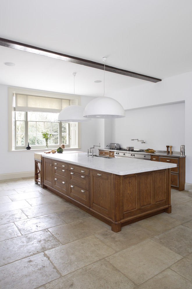 Design ideas for a large contemporary galley open plan kitchen in Gloucestershire with a double-bowl sink, recessed-panel cabinets, dark wood cabinets, marble benchtops, limestone floors and multiple islands.