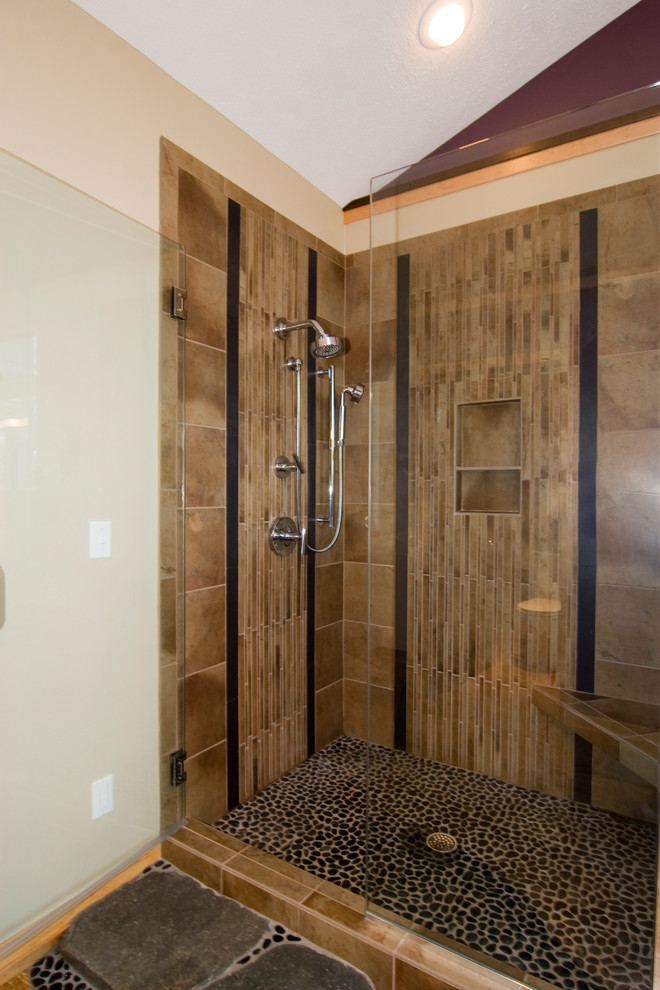 This is an example of a large asian master bathroom in Grand Rapids with a corner shower, brown tile and porcelain tile.