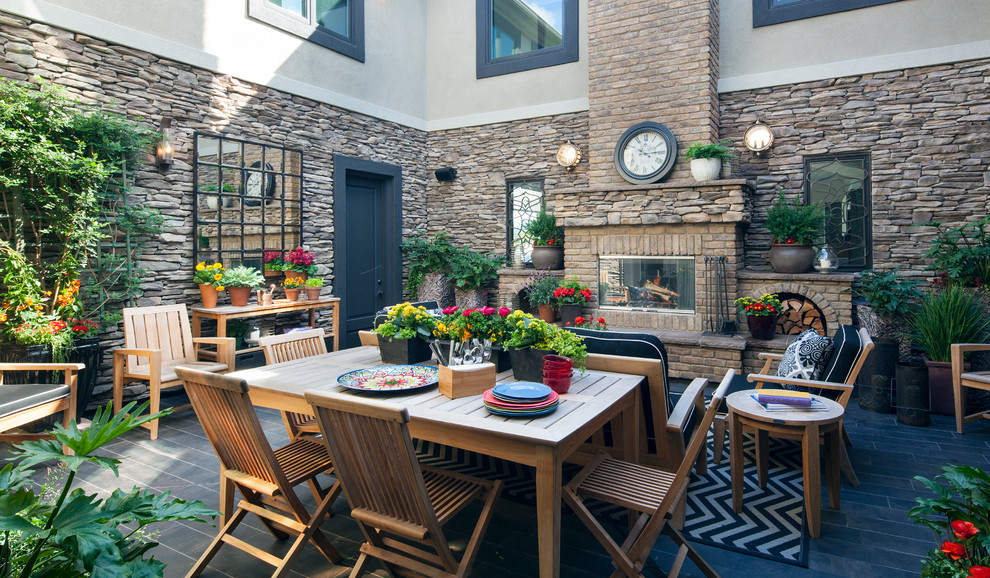 Inspiration for a traditional courtyard patio in Other with a fire feature.