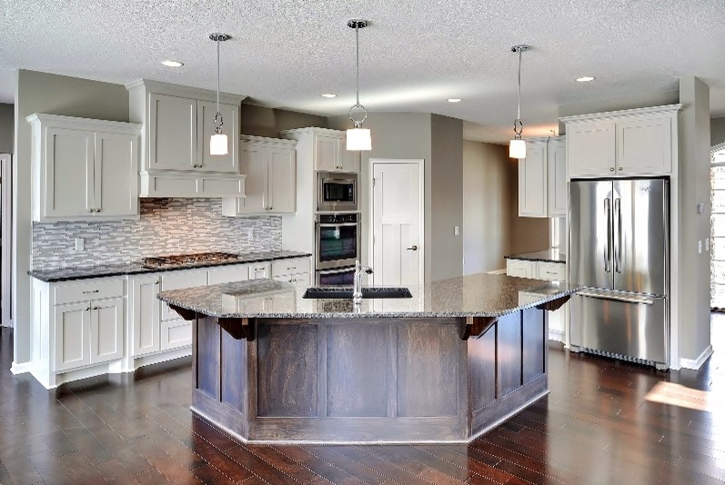 Inspiration for a mid-sized eat-in kitchen remodel in Minneapolis with an island