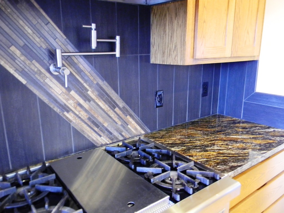 Inspiration for a kitchen remodel in Seattle with light wood cabinets, granite countertops and porcelain backsplash
