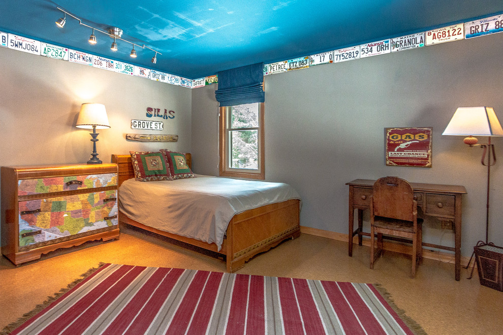 This is an example of a mid-sized contemporary kids' room for boys in Portland Maine with beige walls, cork floors and brown floor.