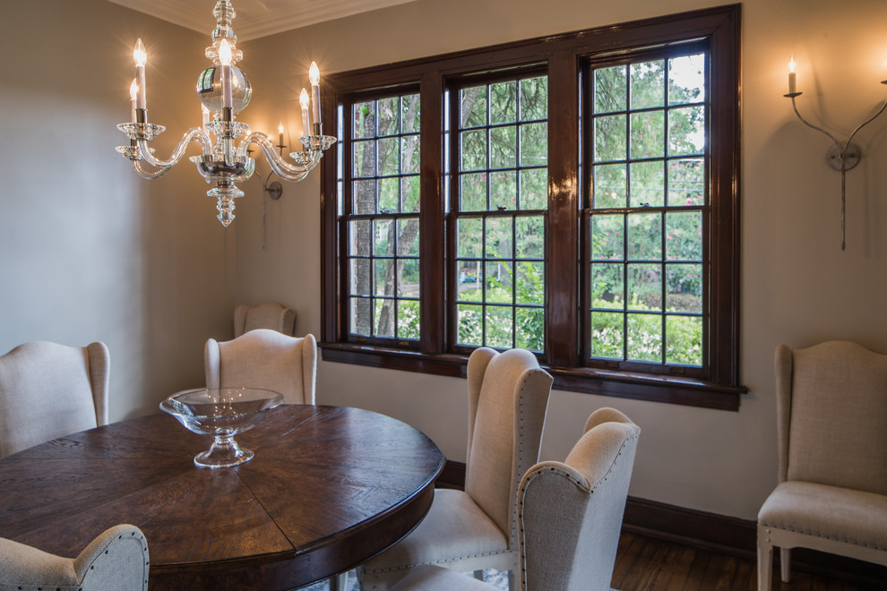 Photo of a mid-sized traditional separate dining room in Jackson with beige walls, medium hardwood floors, no fireplace and brown floor.