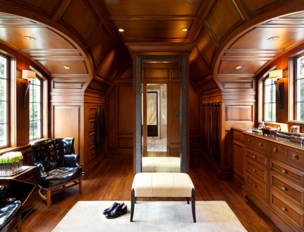 Inspiration for an expansive mediterranean men's dressing room in San Francisco with recessed-panel cabinets and medium wood cabinets.