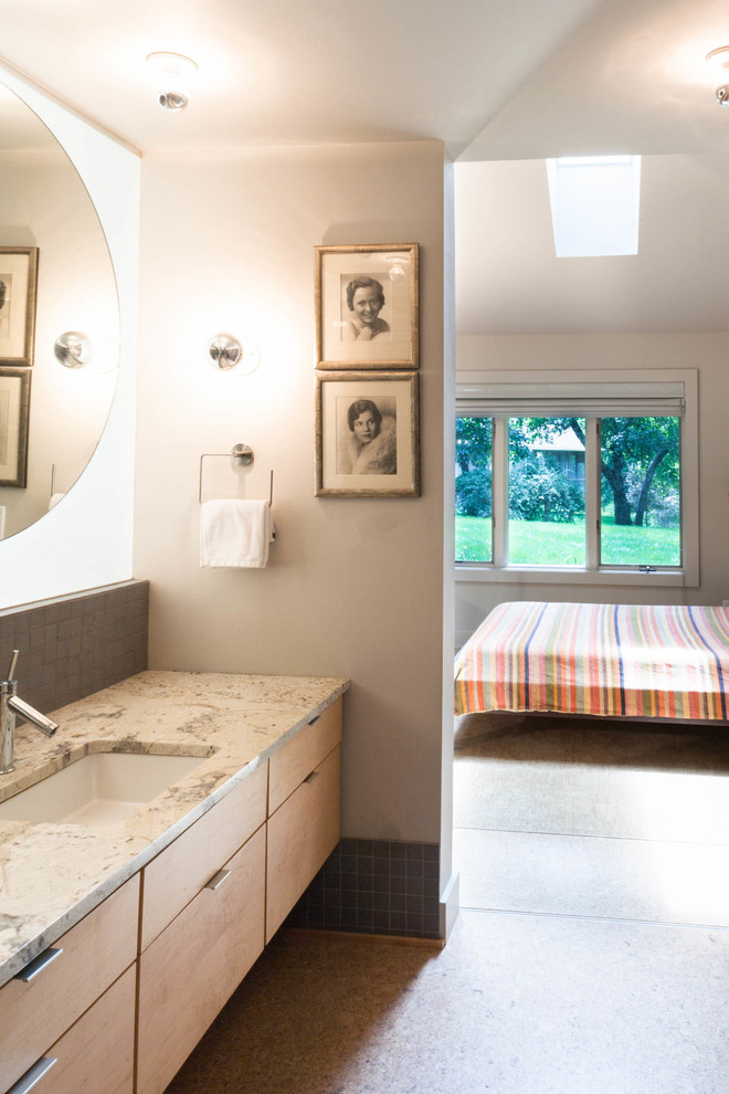 Mid-sized contemporary master bathroom in Cedar Rapids with a drop-in sink, flat-panel cabinets, light wood cabinets, granite benchtops, an open shower, a one-piece toilet, gray tile, porcelain tile, white walls and cork floors.