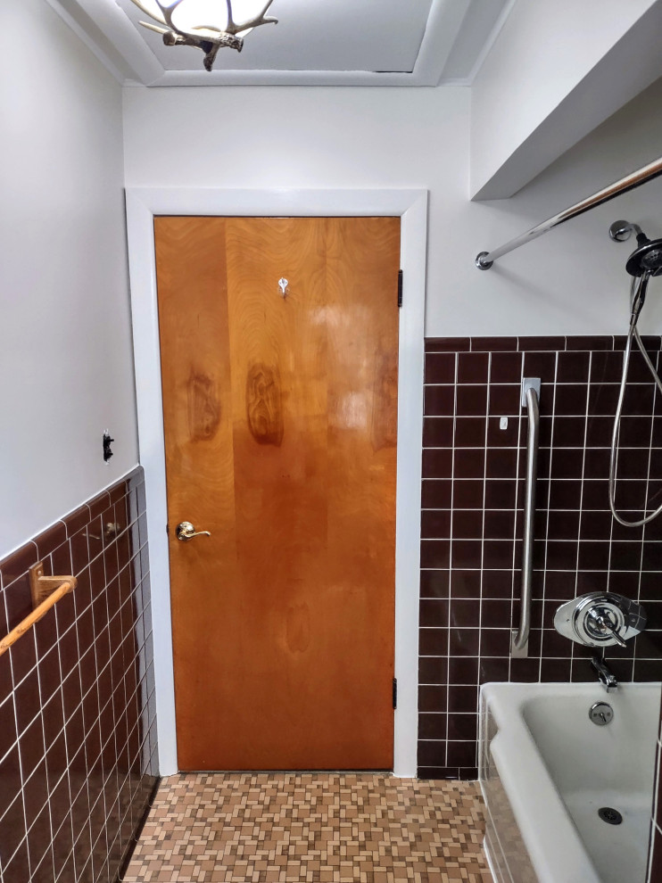 Small traditional ensuite bathroom in Detroit with raised-panel cabinets, brown cabinets, a built-in bath, a shower/bath combination, a two-piece toilet, brown tiles, ceramic tiles, beige walls, ceramic flooring, a built-in sink, laminate worktops, brown floors, a shower curtain, brown worktops, a single sink and a freestanding vanity unit.