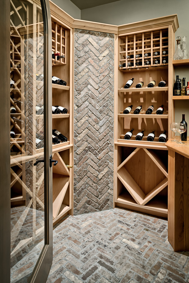 Photo of a modern wine cellar in Other with brick floors.