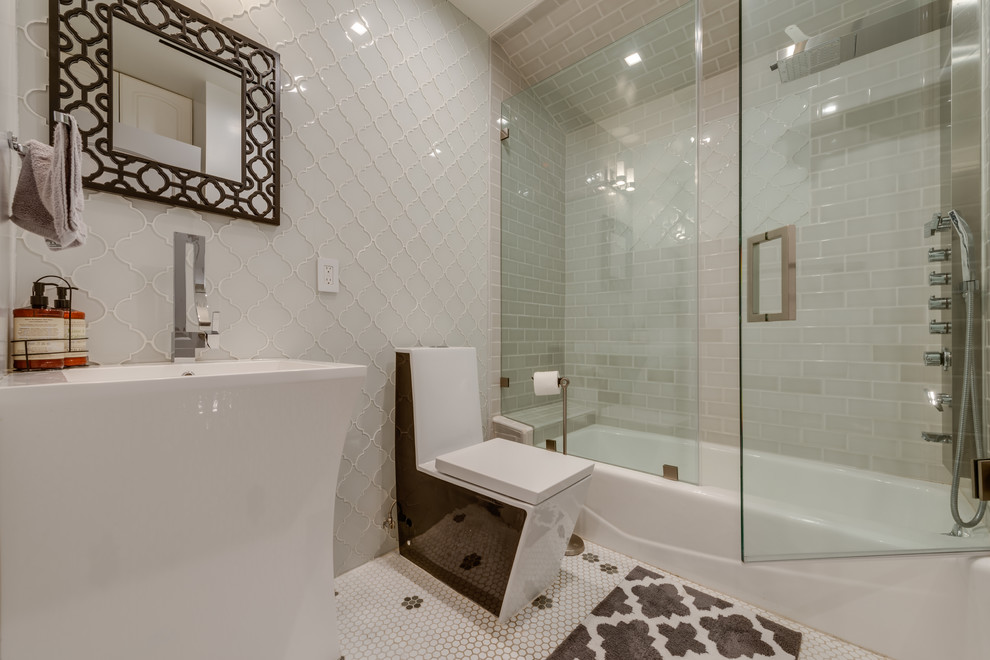 Large midcentury master bathroom in San Francisco with recessed-panel cabinets, white cabinets, an alcove tub, a shower/bathtub combo, a one-piece toilet, multi-coloured tile, ceramic tile, white walls, ceramic floors, an integrated sink and limestone benchtops.