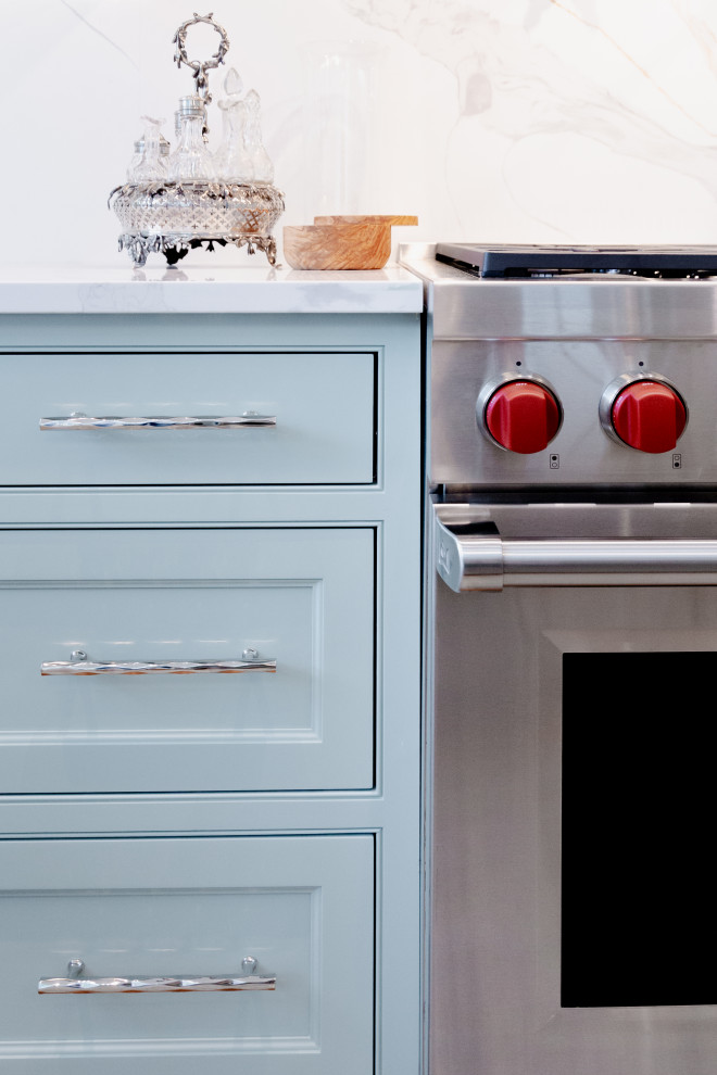 Large transitional u-shaped medium tone wood floor and brown floor open concept kitchen photo in Charleston with an undermount sink, beaded inset cabinets, turquoise cabinets, quartz countertops, white backsplash, quartz backsplash, stainless steel appliances, an island and white countertops