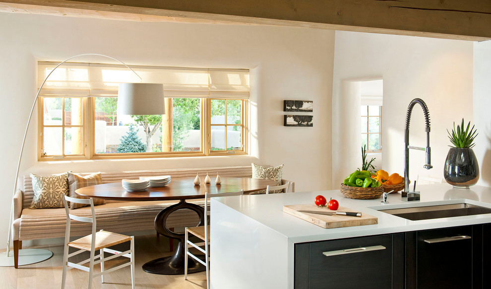 Inspiration for a mediterranean kitchen in Albuquerque with flat-panel cabinets.