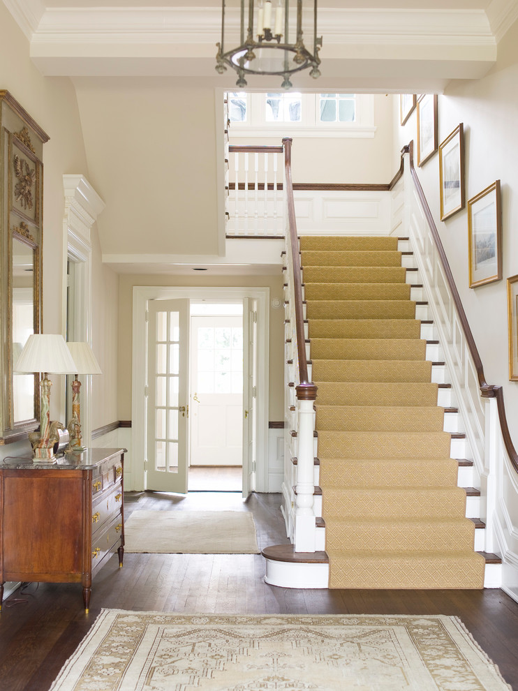 Inspiration for a mid-sized traditional wood u-shaped staircase in Atlanta with painted wood risers.