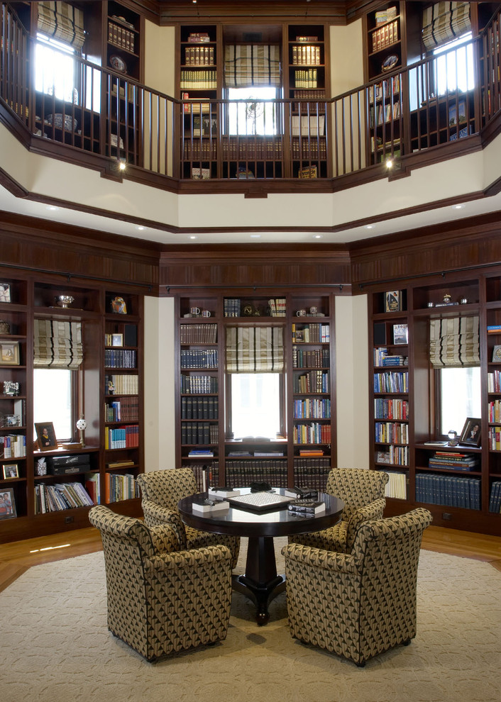 Inspiration for an expansive traditional open concept family room in DC Metro with a library and medium hardwood floors.