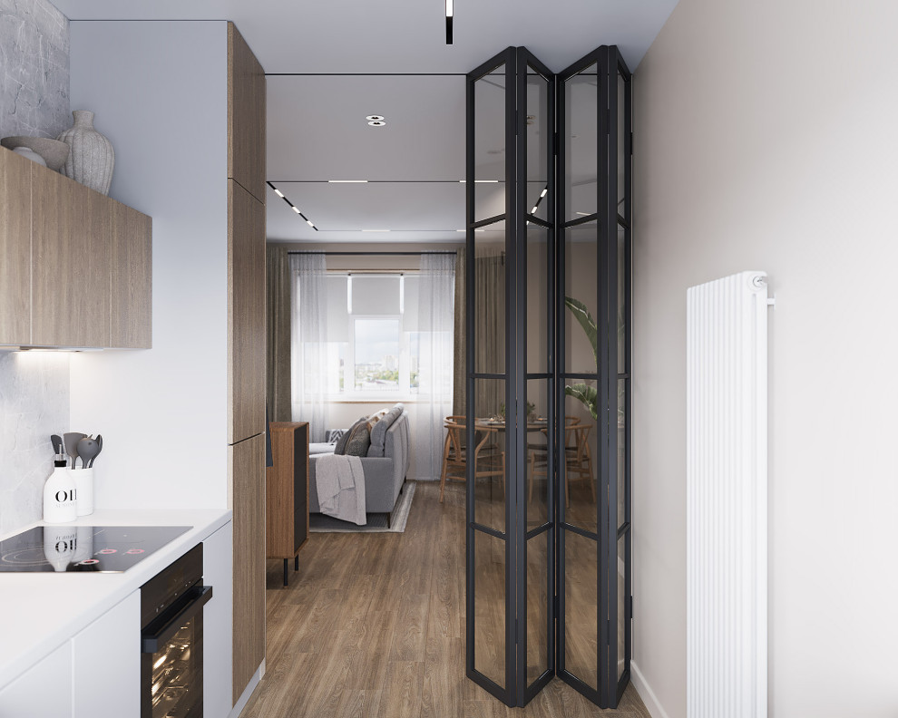 Кухня отделятся от зоны прихожей и гостиной стеклянной перегородкой