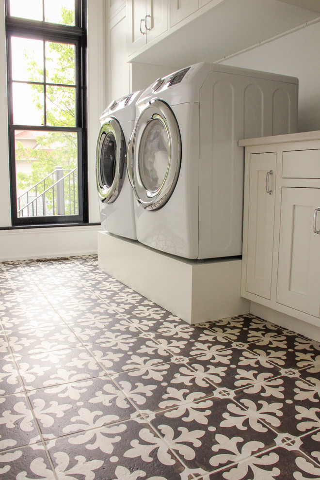 Large traditional single-wall dedicated laundry room in Other with an undermount sink, recessed-panel cabinets, white cabinets, quartz benchtops, white walls, ceramic floors, a side-by-side washer and dryer and brown floor.