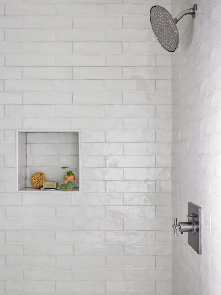 Alcove shower - mid-sized transitional master green tile and ceramic tile marble floor, gray floor and single-sink alcove shower idea in Seattle with shaker cabinets, green cabinets, a one-piece toilet, white walls, an undermount sink, quartzite countertops, a hinged shower door, gray countertops, a niche and a built-in vanity