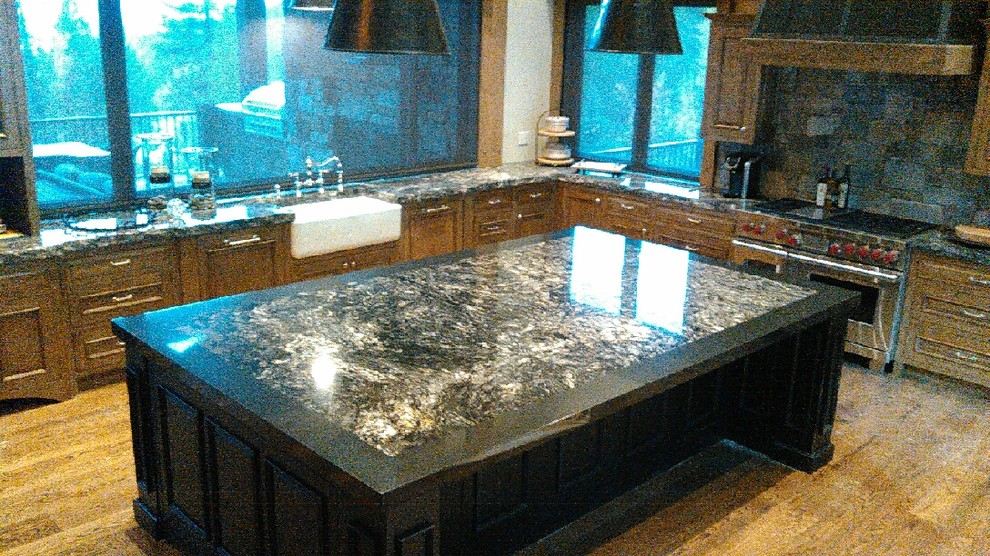 Kitchen - rustic kitchen idea with granite countertops and an island