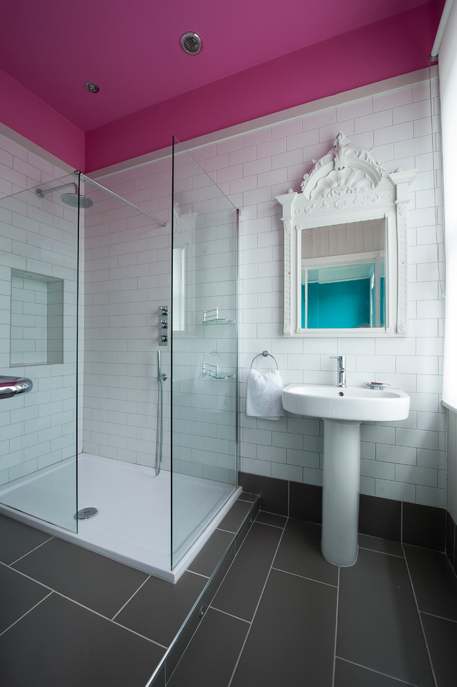 Design ideas for a small eclectic master bathroom in Gloucestershire with a pedestal sink, flat-panel cabinets, an open shower, a two-piece toilet, white tile, ceramic tile, grey walls and ceramic floors.