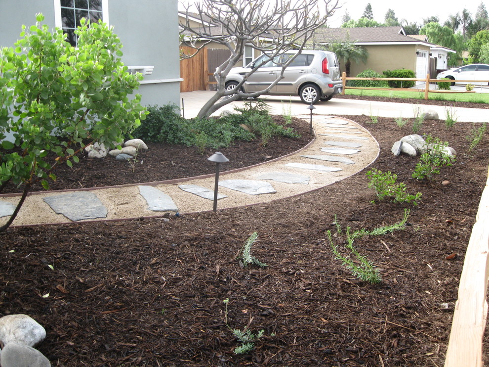 This is an example of a small eclectic front yard full sun formal garden in Orange County.