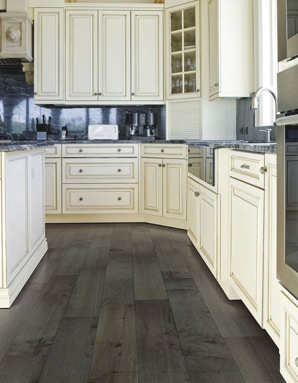 Inspiration for a mid-sized transitional l-shaped dark wood floor kitchen remodel in Indianapolis with a farmhouse sink, raised-panel cabinets, white cabinets, granite countertops, gray backsplash, stone slab backsplash, stainless steel appliances and an island