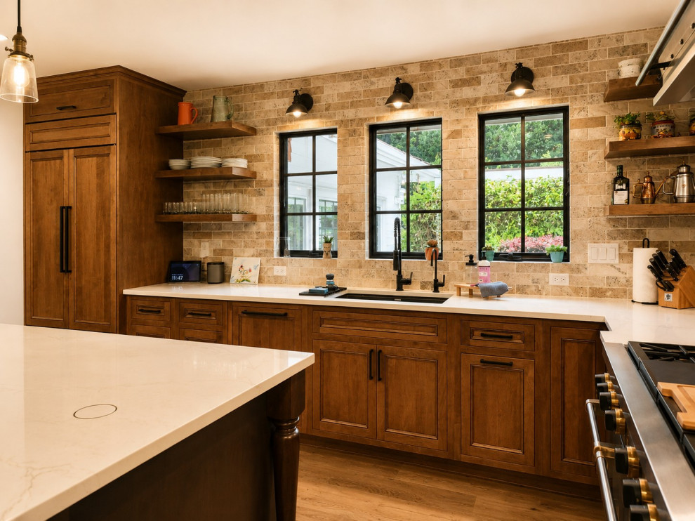 Transitional l-shaped eat-in kitchen photo in Seattle with recessed-panel cabinets, medium tone wood cabinets and an island