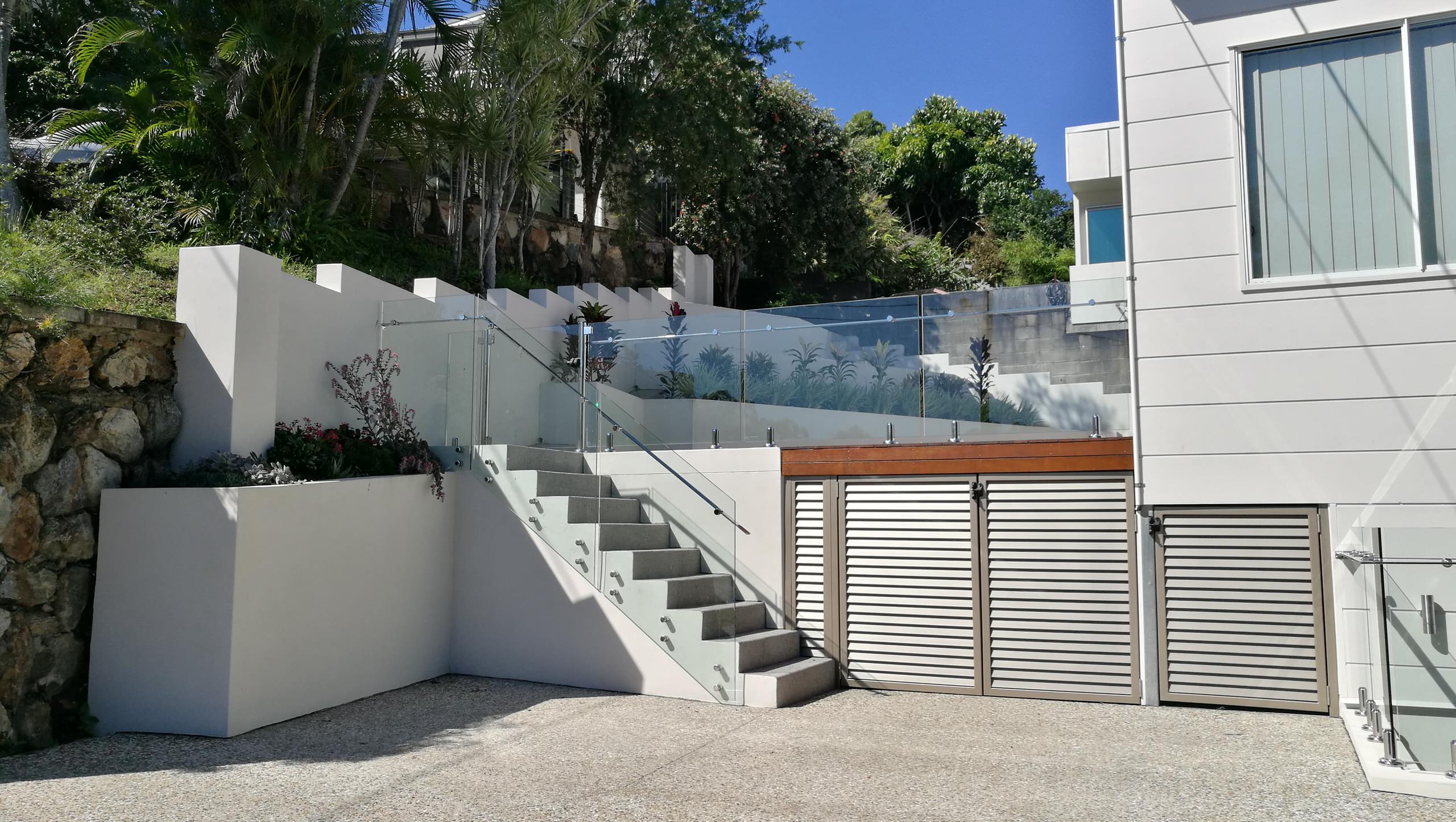 concealed bin enclosure under new deck