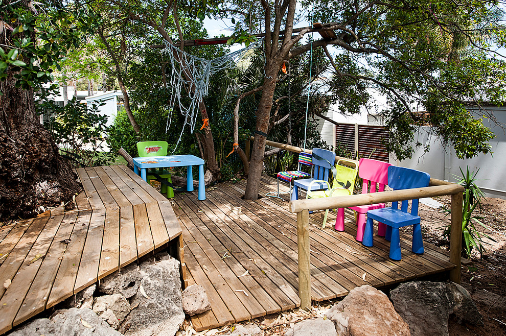 Inspiration for a mid-sized contemporary garden in Perth with with outdoor playset.