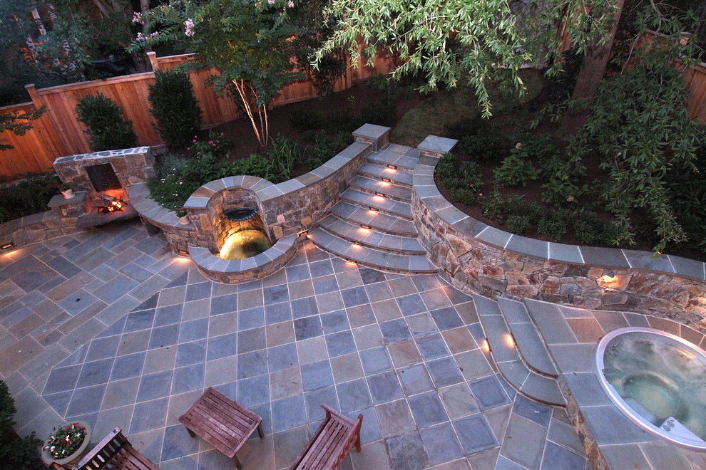 Inspiration for a traditional patio in DC Metro with a water feature.