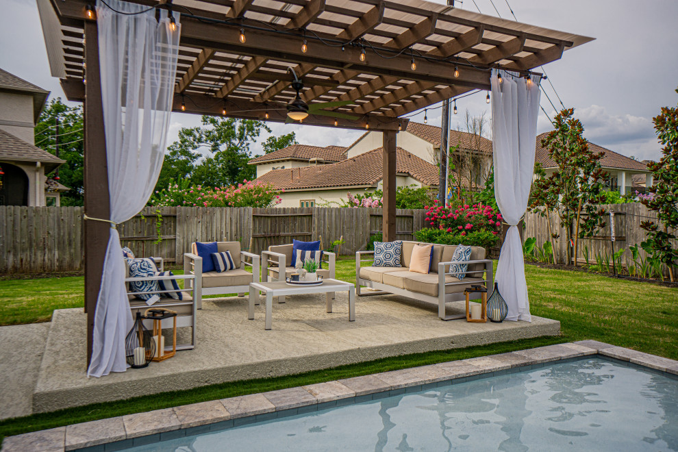Design ideas for a large transitional backyard patio in Houston with decking and a pergola.