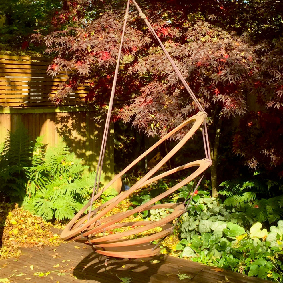 Contemporary back formal partial sun garden for summer in Surrey.