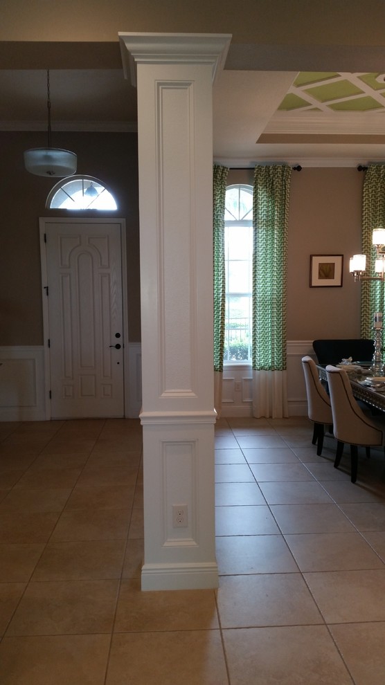 Small traditional separate dining room in Tampa with brown walls, ceramic floors, no fireplace and beige floor.