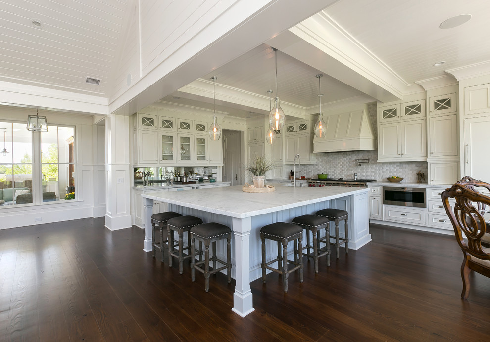 Transitional eat-in kitchen in Charleston with beaded inset cabinets, white cabinets, grey splashback, stainless steel appliances, dark hardwood floors and with island.