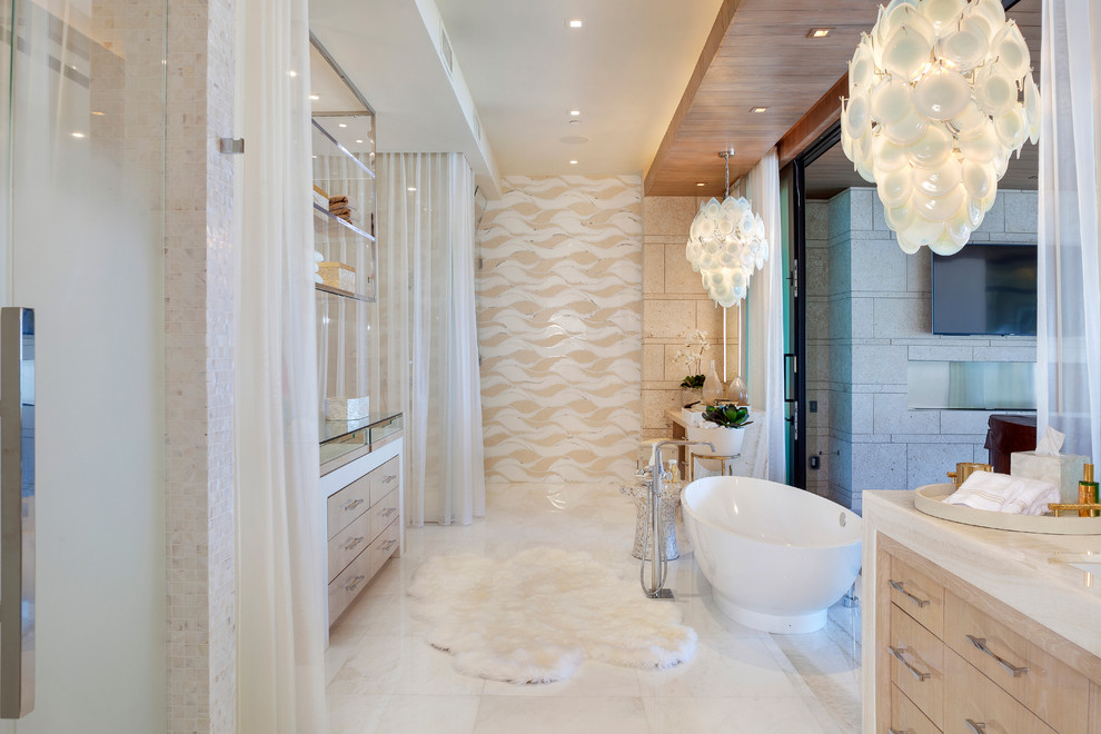 Photo of a contemporary master bathroom in Miami with flat-panel cabinets, light wood cabinets, a freestanding tub and multi-coloured tile.