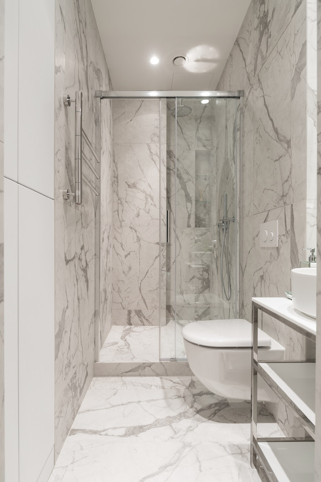 Design ideas for a small contemporary 3/4 bathroom in Saint Petersburg with open cabinets, a wall-mount toilet, gray tile, white tile, marble, marble floors, a vessel sink, grey floor, white cabinets, an alcove shower, white walls and a sliding shower screen.