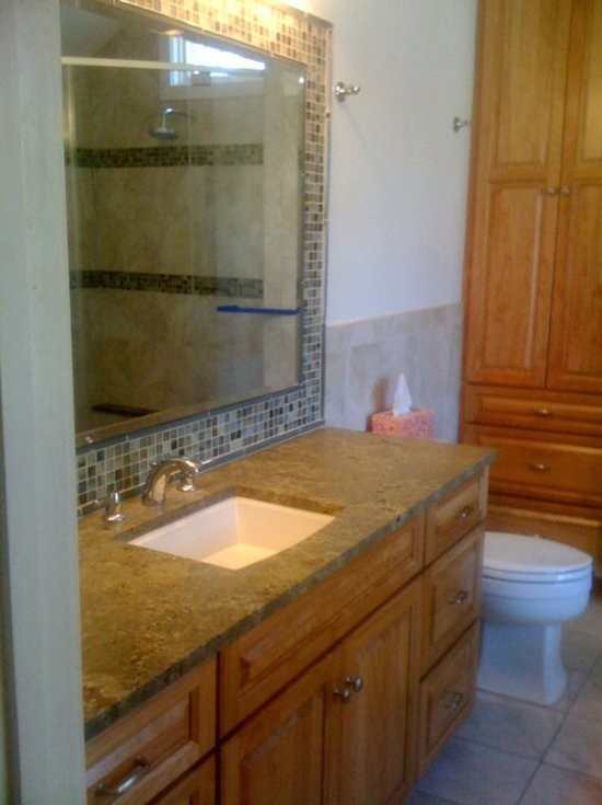 Inspiration for a transitional beige tile bathroom remodel in Boston with an undermount sink, medium tone wood cabinets and white walls