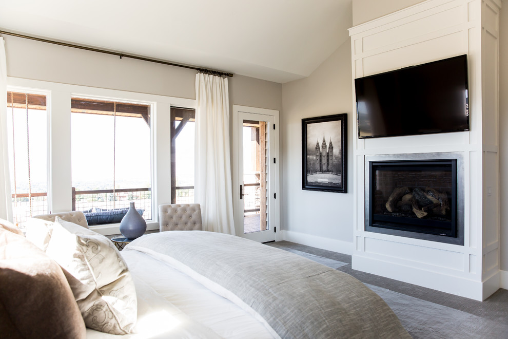 Inspiration for a large country master bedroom in Salt Lake City with beige walls, carpet, a standard fireplace and a metal fireplace surround.