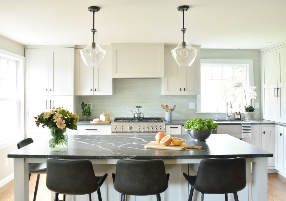 Inspiration for a transitional kitchen in Boston with recessed-panel cabinets, granite benchtops, ceramic splashback, stainless steel appliances, medium hardwood floors, with island, grey benchtop and white cabinets.