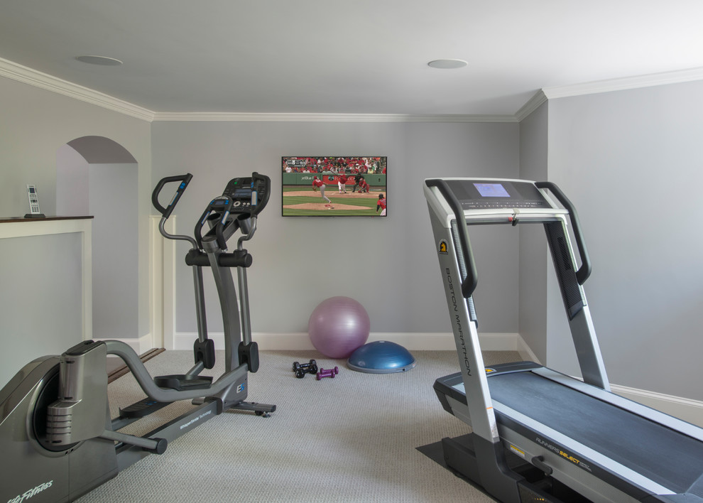 Photo of a mid-sized transitional multipurpose gym in Boston with grey walls, carpet and grey floor.