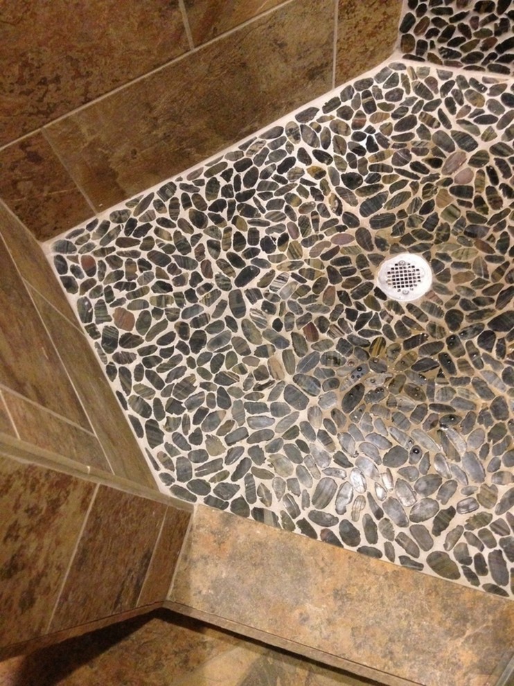 This is an example of a country bathroom in Little Rock with beige tile and porcelain tile.